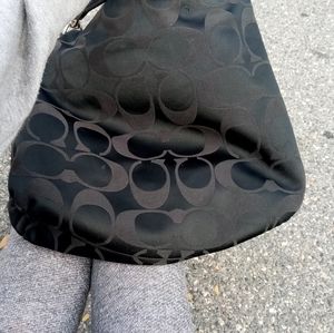 Double stitched coach purse.
